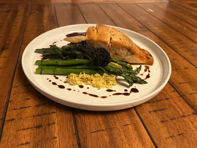 Roasted salmon with asparagus and saffron orzo